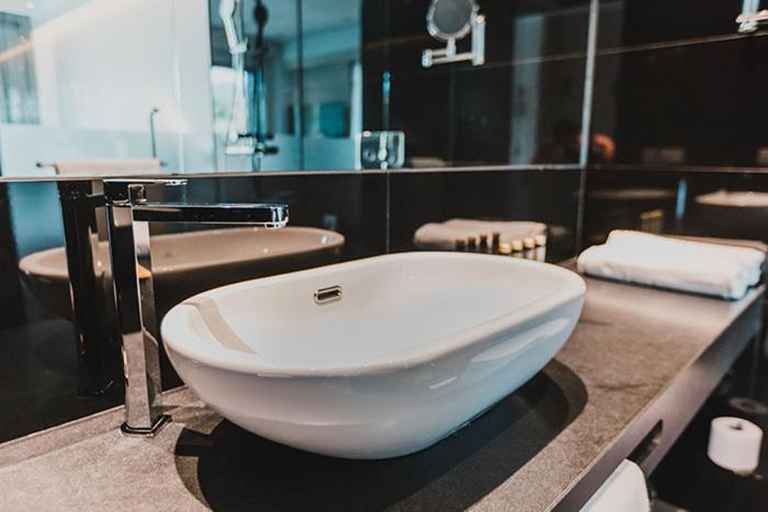 a bathroom with a white bowl sink on a counter at H Boutique Peña Parda in La Herradura