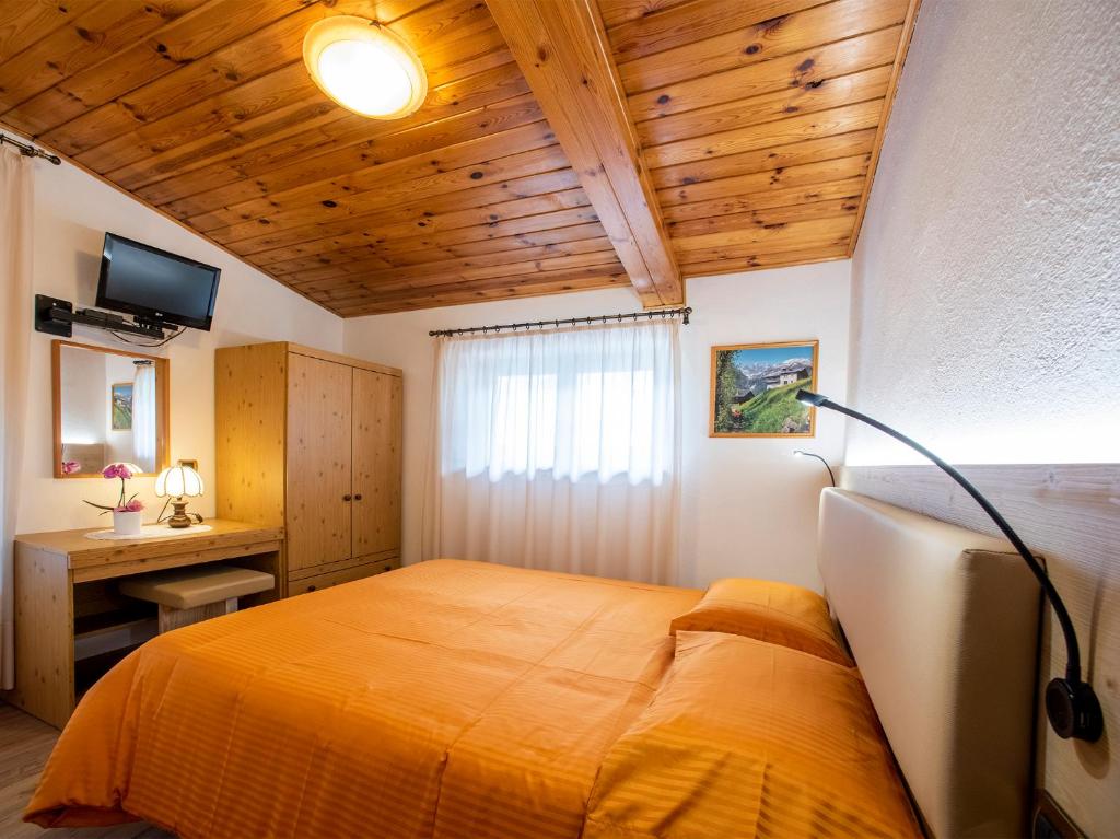 Postel nebo postele na pokoji v ubytování Hotel Adriana