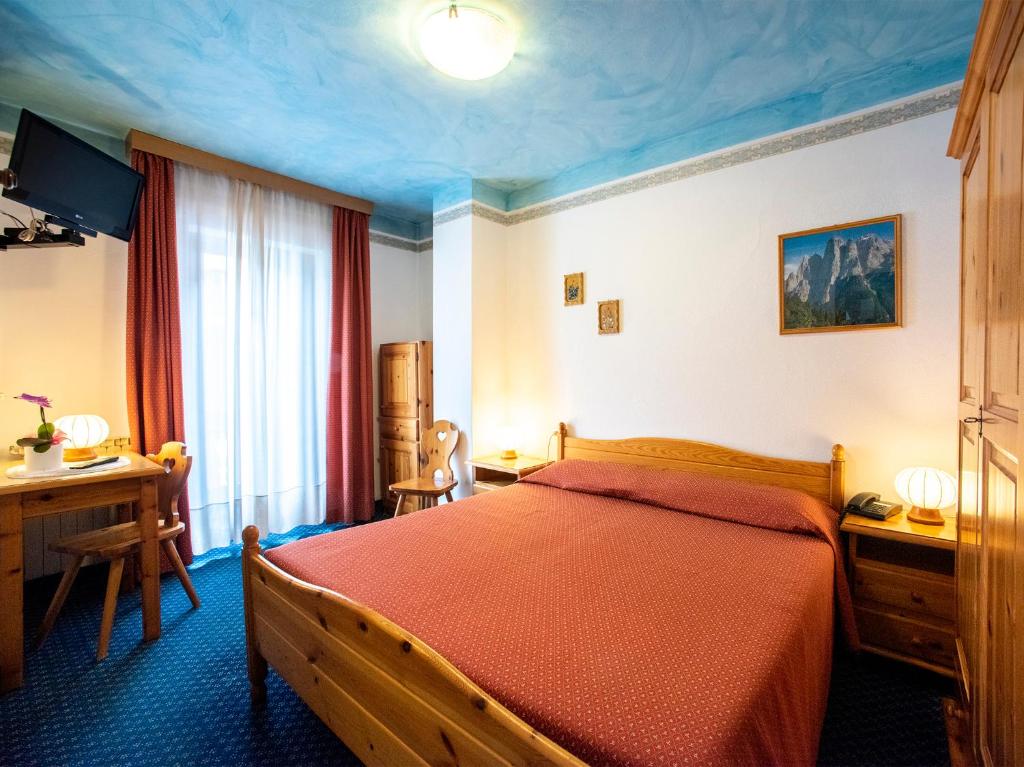 Postel nebo postele na pokoji v ubytování Hotel Adriana