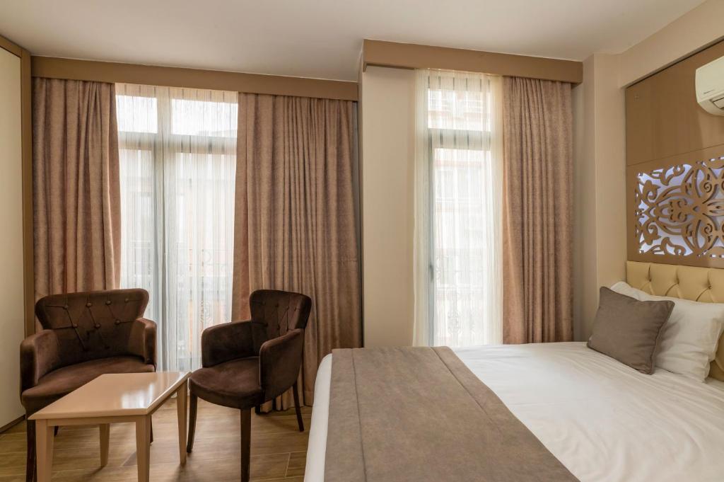 Postel nebo postele na pokoji v ubytování Taksim Peri Suite
