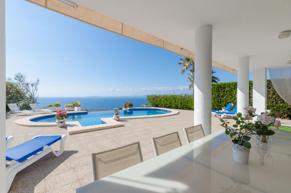 a villa with a view of the swimming pool at YourHouse Somni in Llucmajor