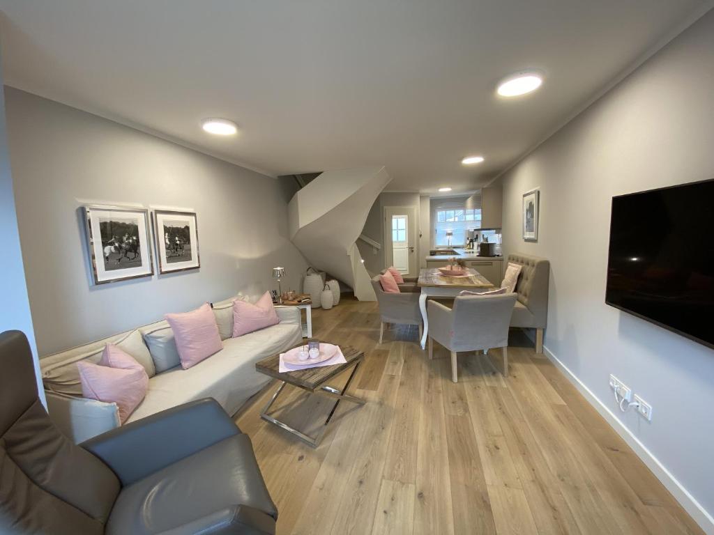 a living room with a couch and a table at Haus Oscar in Westerland in Westerland