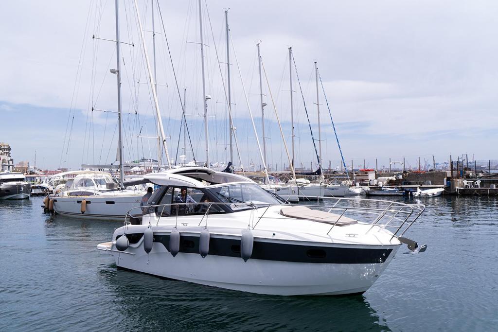 a group of boats docked in a harbor at GreRos Yacht by ClaPa H.&G Group in Naples