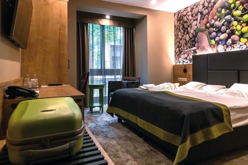 Postel nebo postele na pokoji v ubytování Oliva Hotel