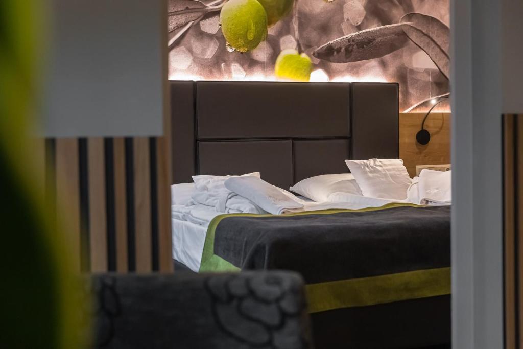 Postel nebo postele na pokoji v ubytování Oliva Hotel