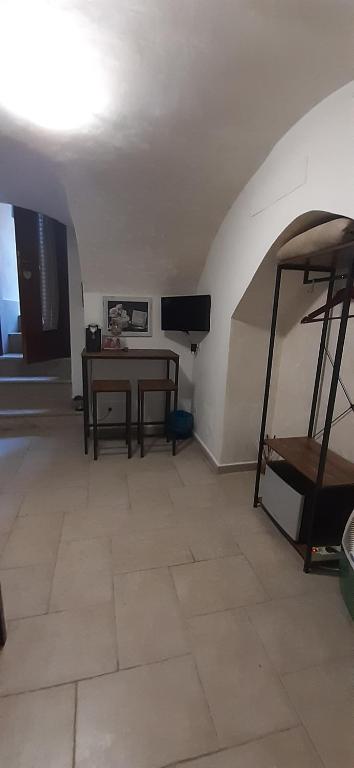 Televízia a/alebo spoločenská miestnosť v ubytovaní La casetta nel claustro 2