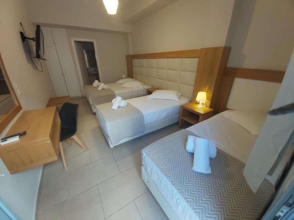 Postel nebo postele na pokoji v ubytování Villa Roussa City Center