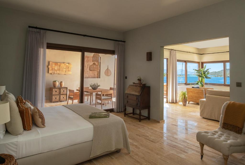 a bedroom with a bed and a living room at Karia Bel - Adult Only +12 in Bozburun