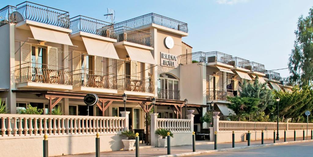 a building with balconies on the side of a street at Irilena Hotel in Lassi