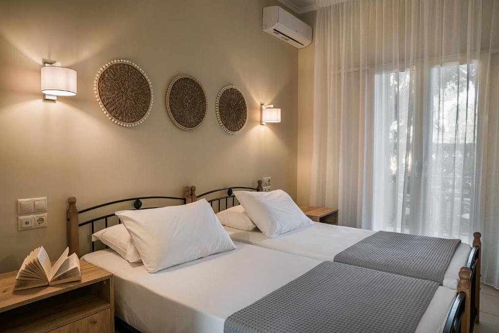 Postel nebo postele na pokoji v ubytování Irilena Hotel