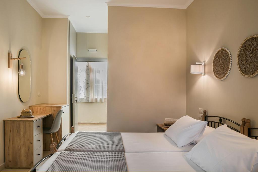 Postel nebo postele na pokoji v ubytování Irilena Hotel