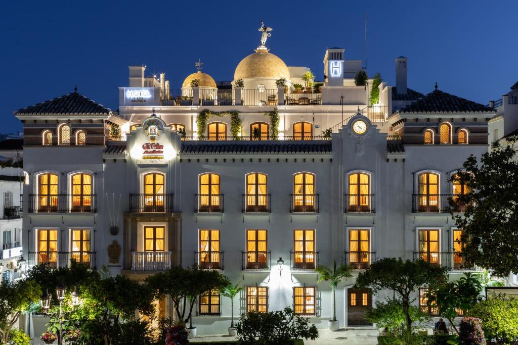 a building with a dome on top at night at Hotel Silken El Pilar Andalucia in Estepona