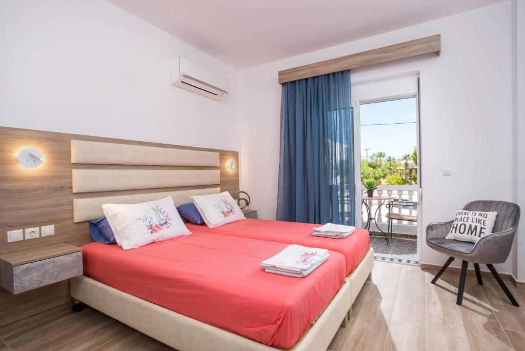 A bed or beds in a room at Dimitra Faliraki Center Apartments