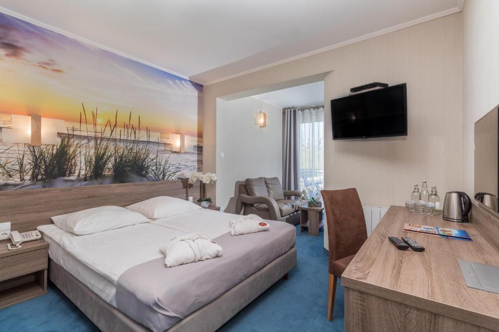 Televízia a/alebo spoločenská miestnosť v ubytovaní Hotel SPA Activia