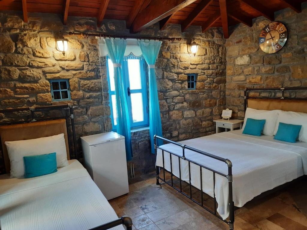 Giường trong phòng chung tại EFLİN BUTİK OTEL