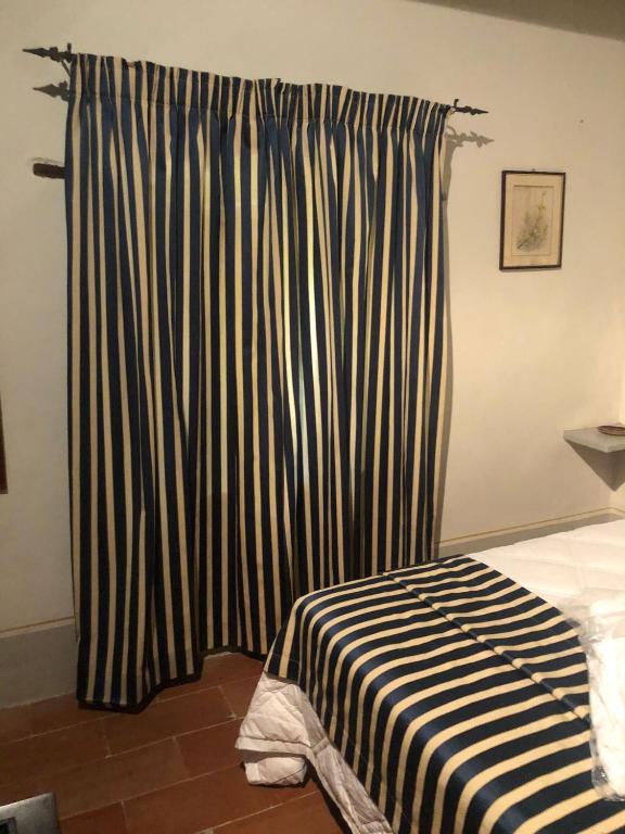 Postel nebo postele na pokoji v ubytování Albergo Le Casaline