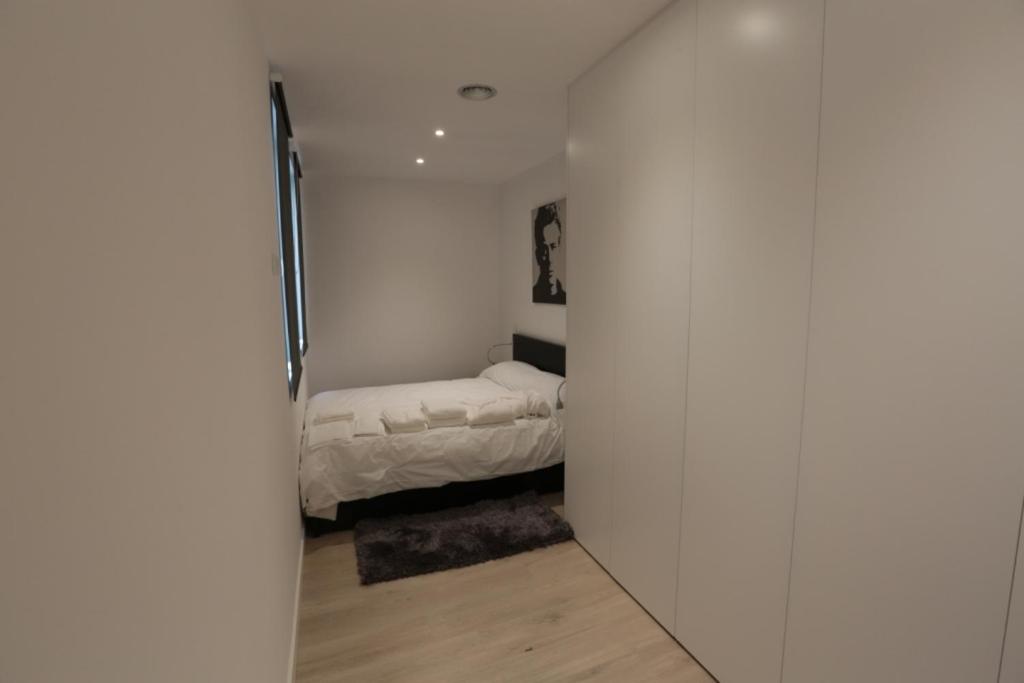 A bed or beds in a room at Las Infantas Zona Centro