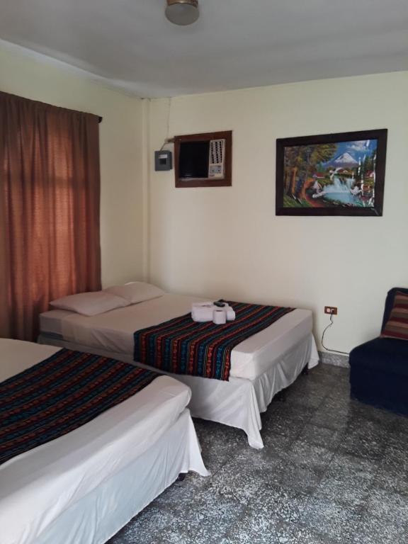 Postel nebo postele na pokoji v ubytování HOTEL EL ALMENDRO
