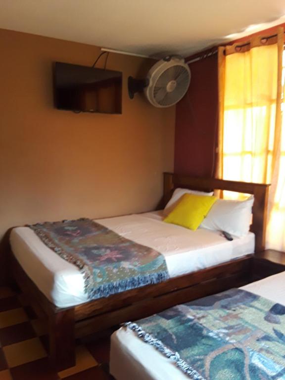 Postel nebo postele na pokoji v ubytování HOTEL EL ALMENDRO