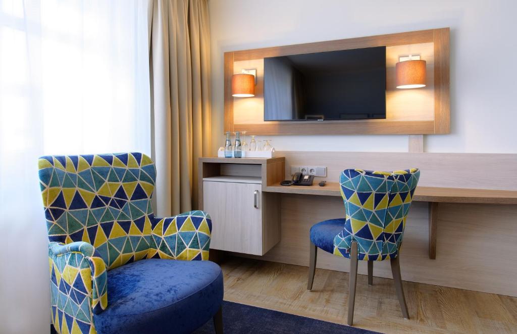 TV a/nebo společenská místnost v ubytování Hotel Graf Bentinck
