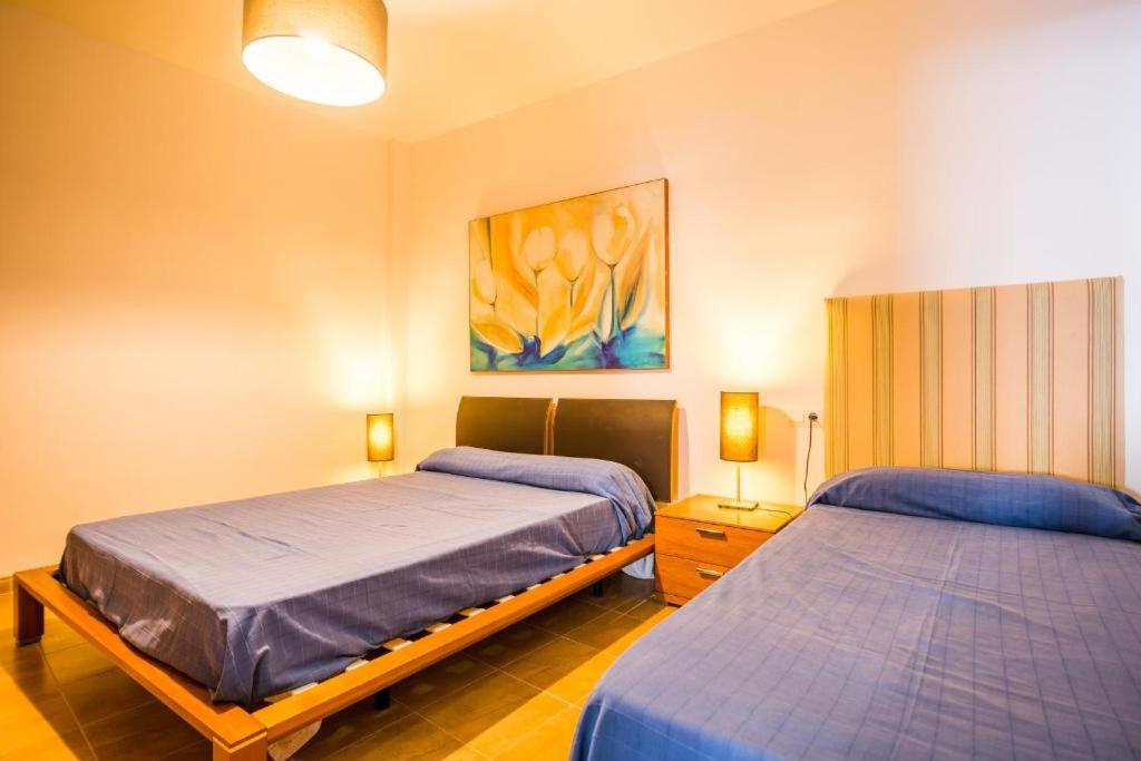 Posteľ alebo postele v izbe v ubytovaní Apartamentos Mirablau