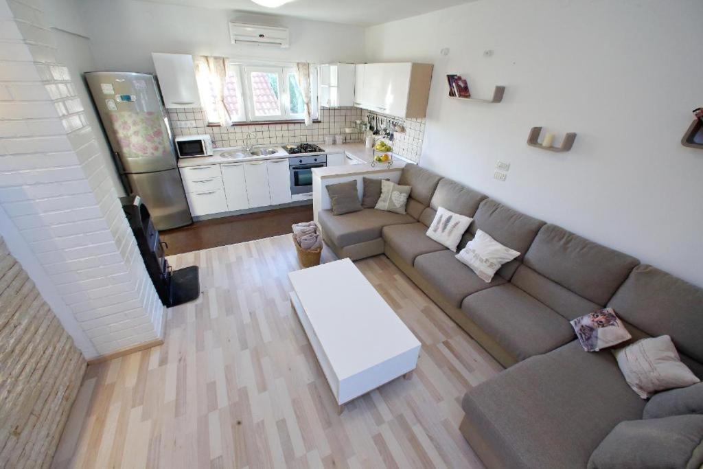 a living room with a couch and a table at Francesca Apartment in Bibinje