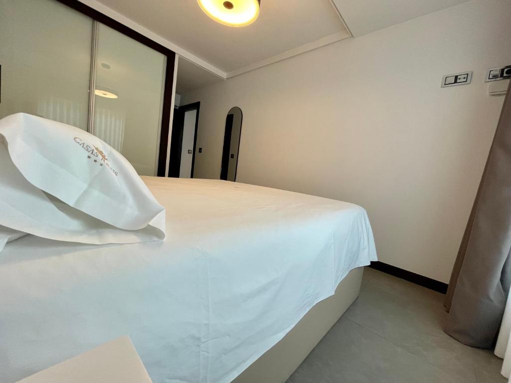 A bed or beds in a room at Luxury boutique playa Silgar