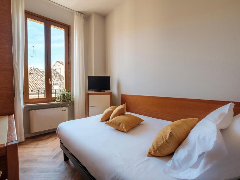 Postel nebo postele na pokoji v ubytování Hotel Lory