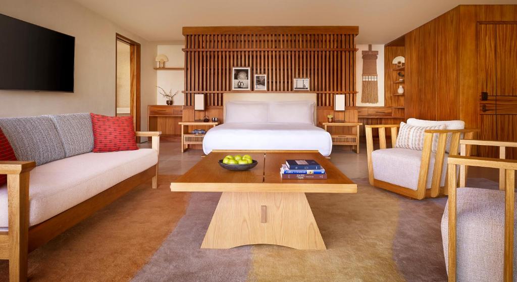 a living room filled with furniture and a couch at Nobu Hotel Los Cabos in Cabo San Lucas