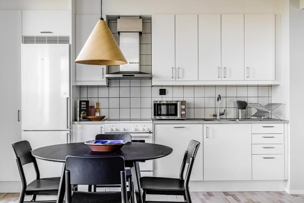 Kuchyň nebo kuchyňský kout v ubytování Comfort Hotel Solna Arenastaden