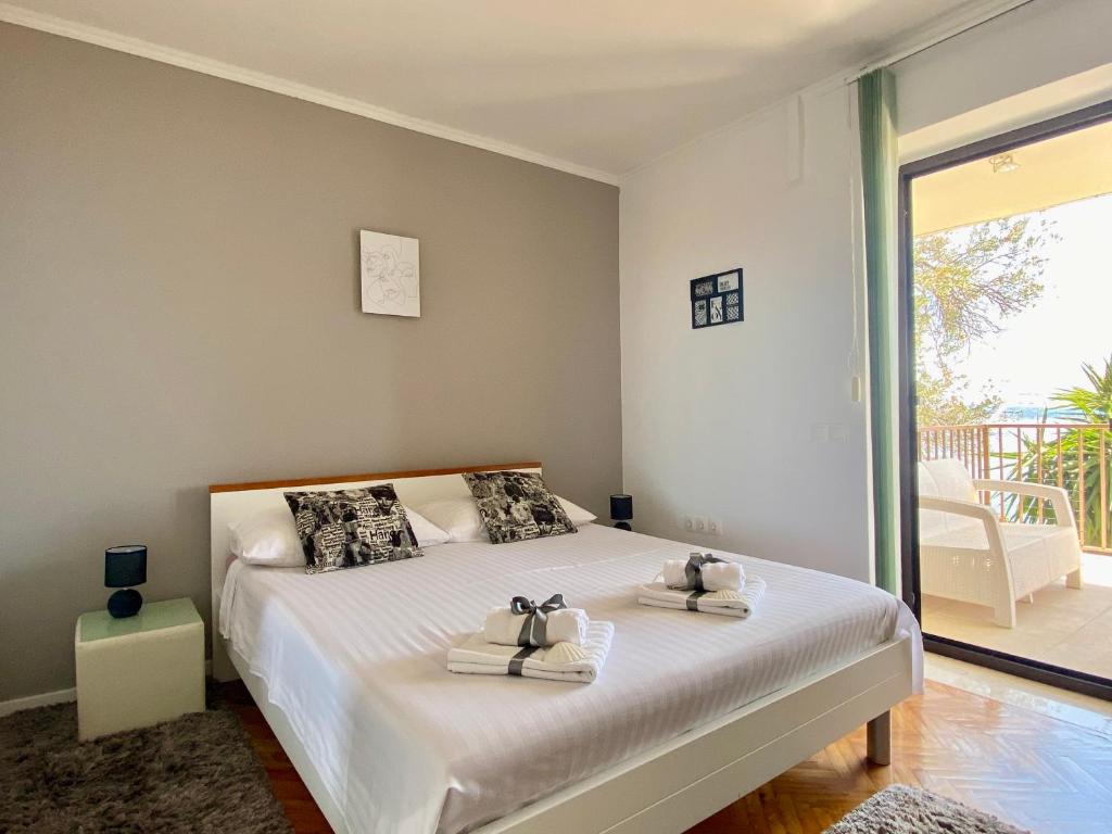 Posteľ alebo postele v izbe v ubytovaní Apartments La Perla