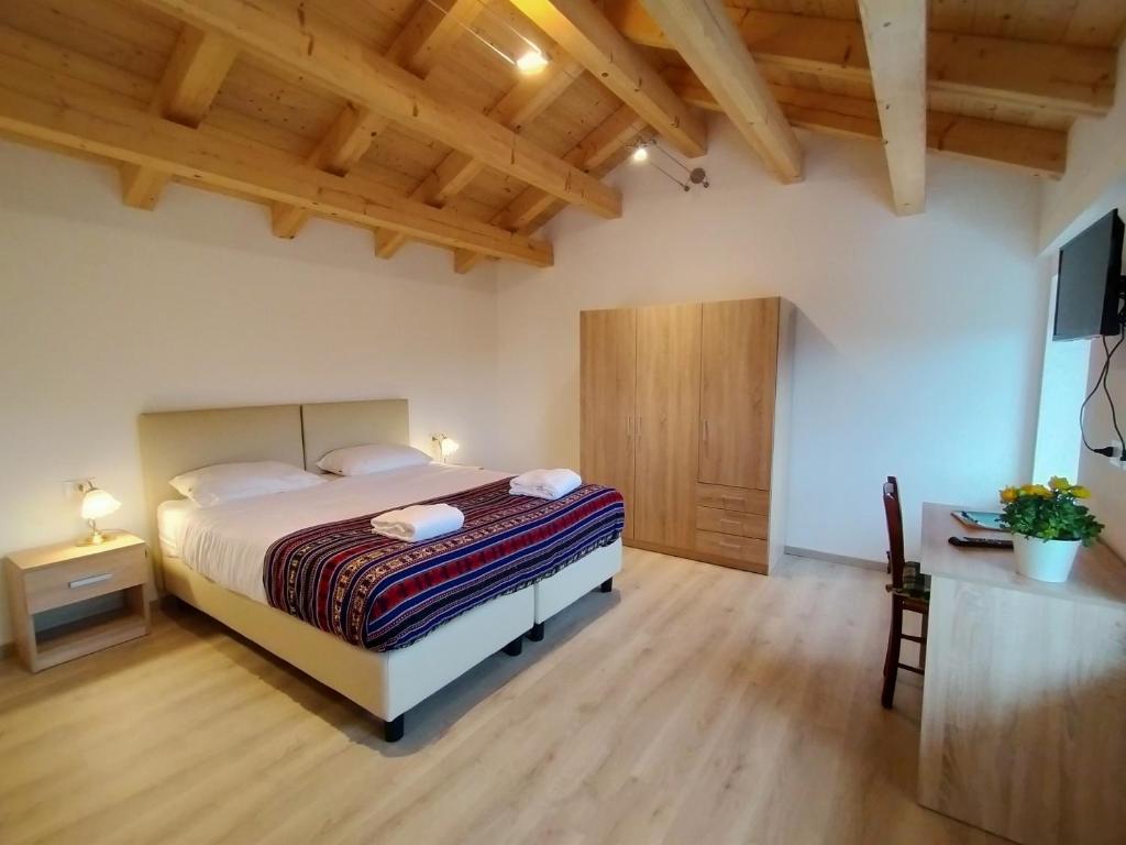 Postel nebo postele na pokoji v ubytování Antico Melo B&B