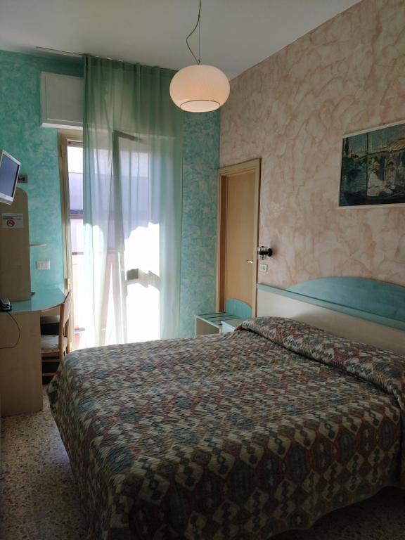 Postel nebo postele na pokoji v ubytování Hotel Prestigio