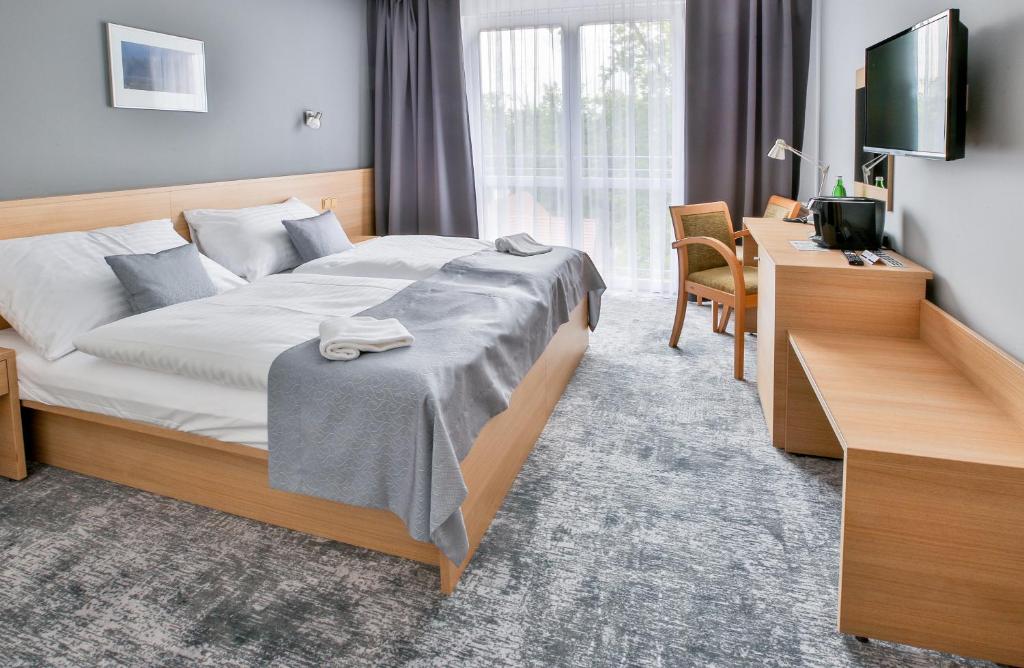 Postel nebo postele na pokoji v ubytování LH Parkhotel Hluboka Nad Vltavou Congress & Wellness
