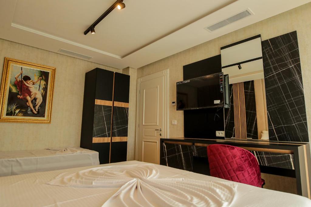 Postel nebo postele na pokoji v ubytování Rozafa Blu Hotel