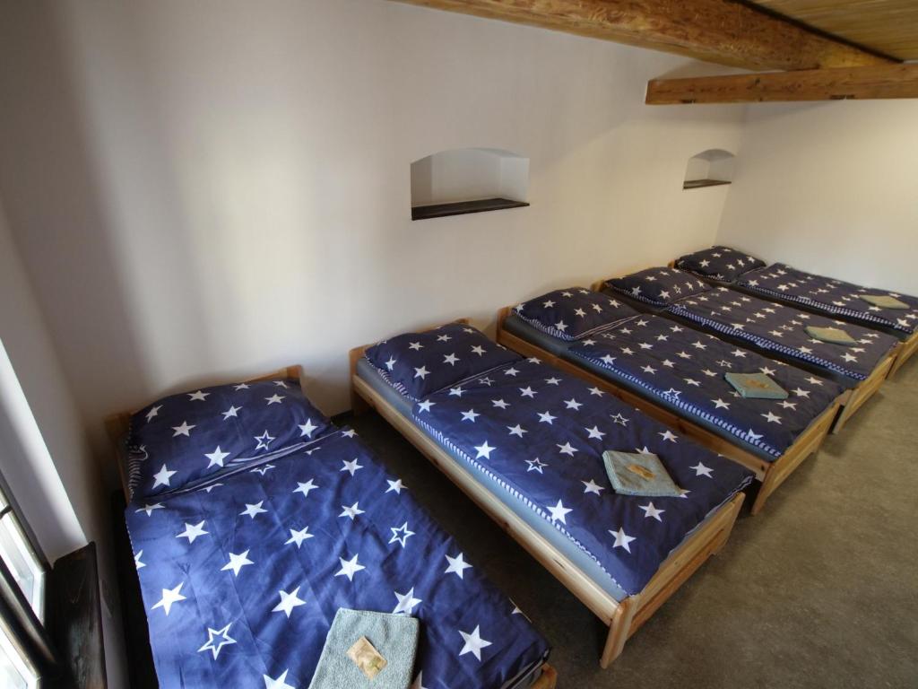 Postel nebo postele na pokoji v ubytování Pivovar Mlýn