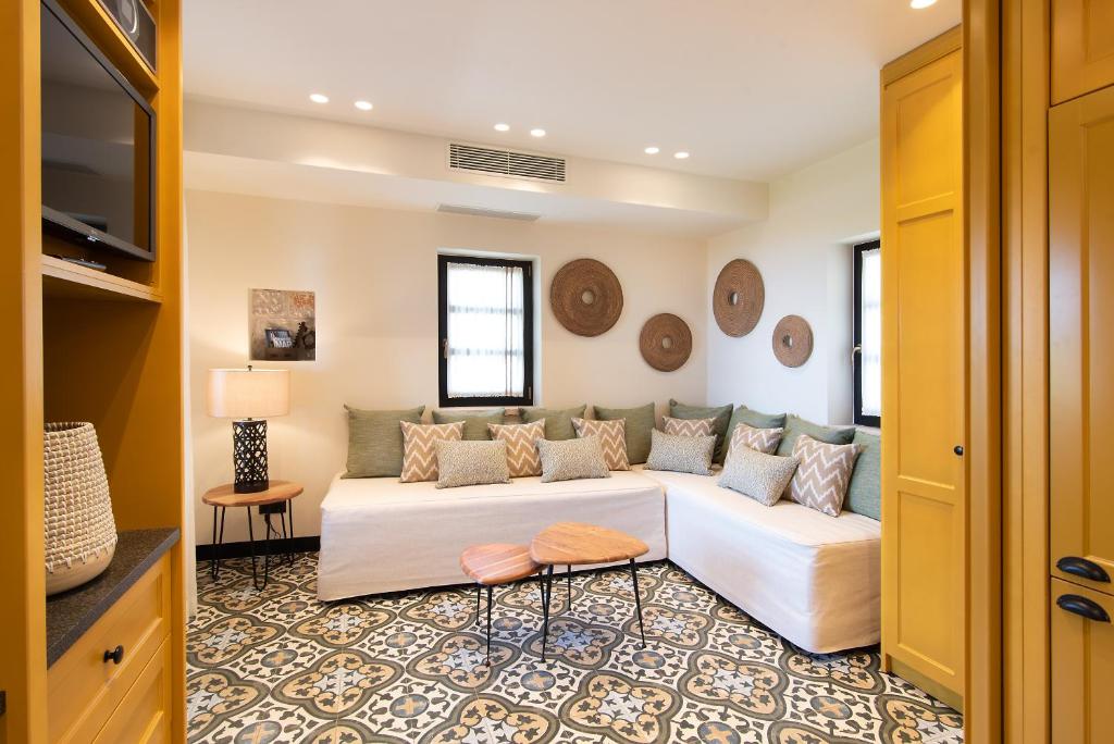 A bed or beds in a room at Polismata - Private Residences