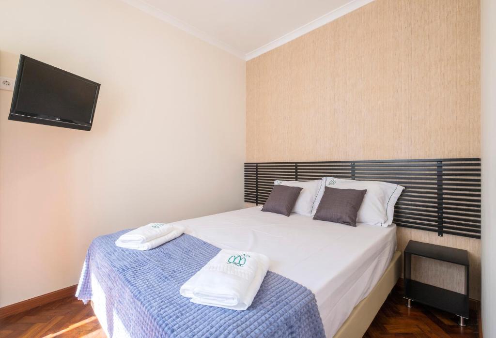 Postel nebo postele na pokoji v ubytování Passal Hostel