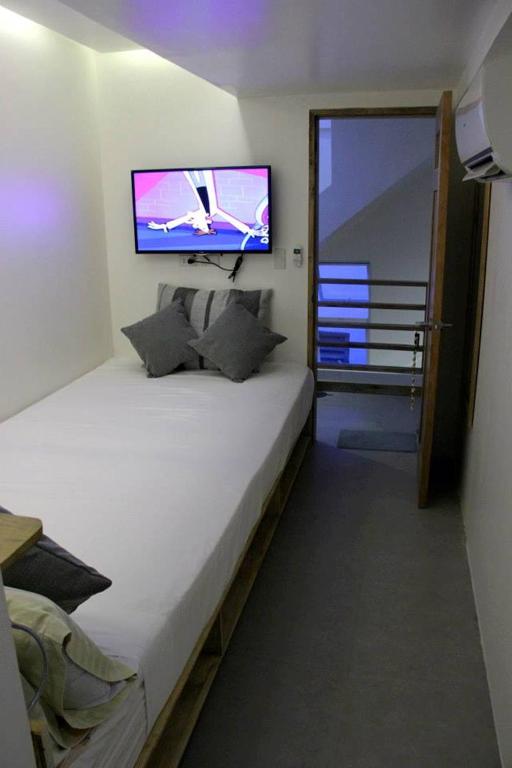 Postel nebo postele na pokoji v ubytování Zuzuni Boutique Hotel