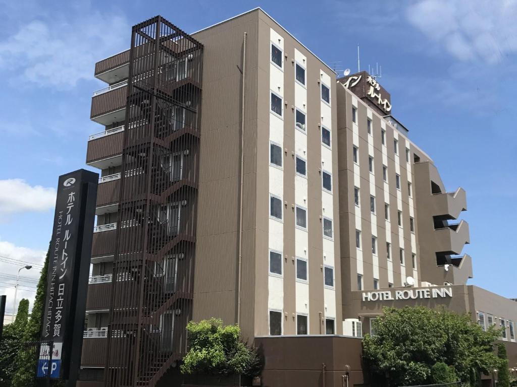 a hotel building with a spiral at Hotel Route-Inn Hitachitaga in Hitachi