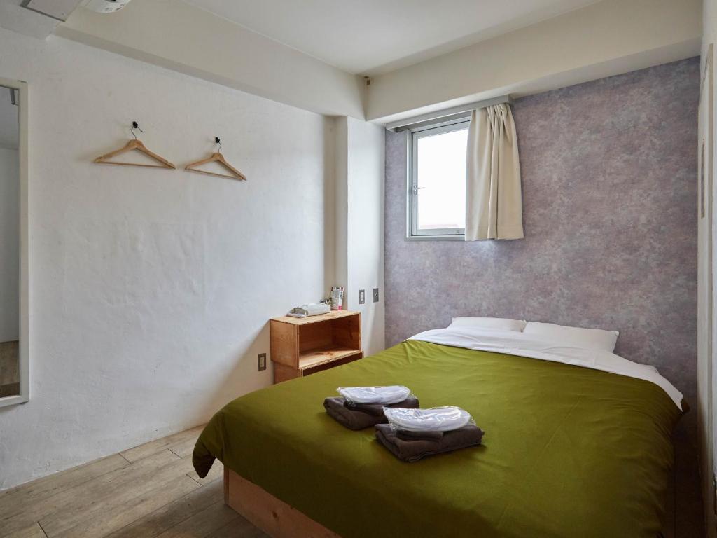 Postel nebo postele na pokoji v ubytování Hostel Cuore Kurashiki