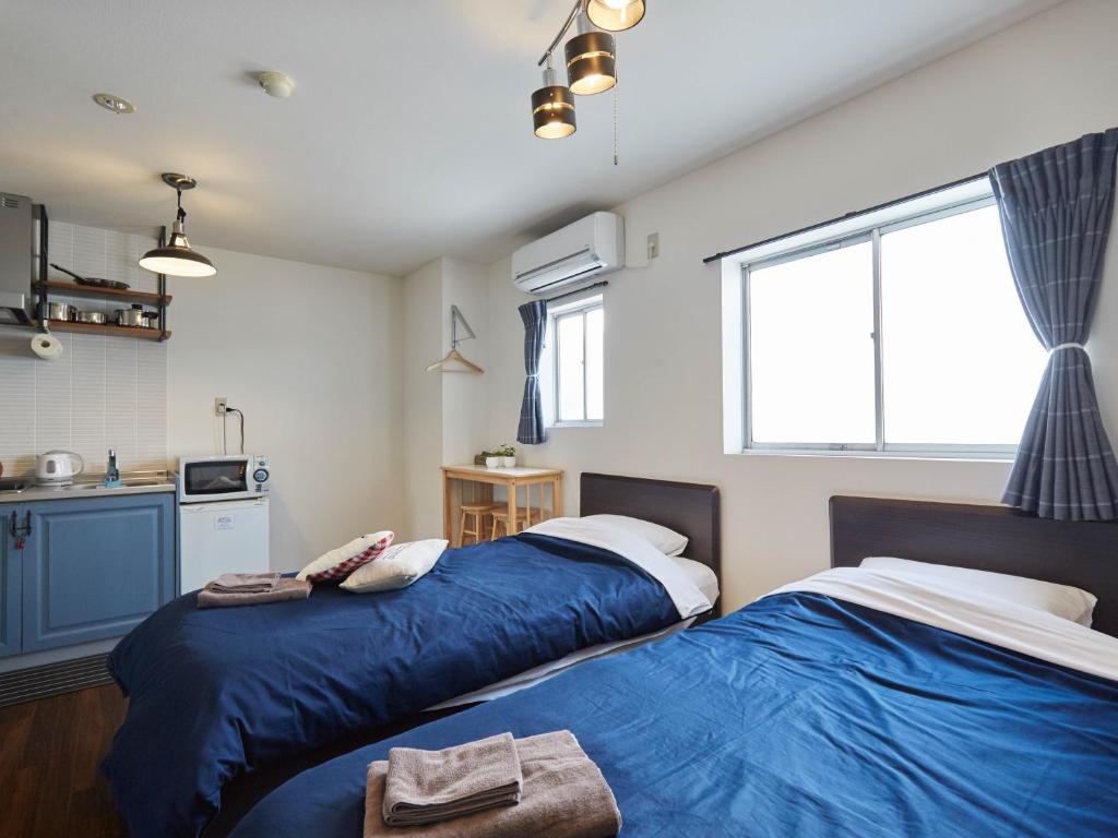Postel nebo postele na pokoji v ubytování Hostel Cuore Kurashiki