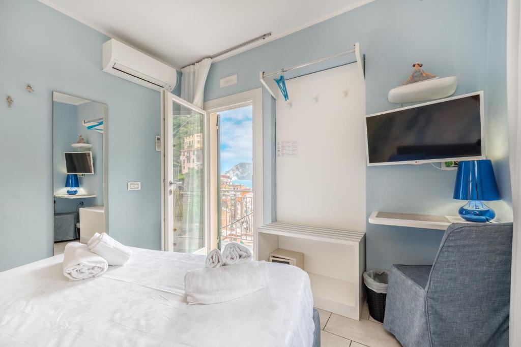 Postel nebo postele na pokoji v ubytování Casa Catò