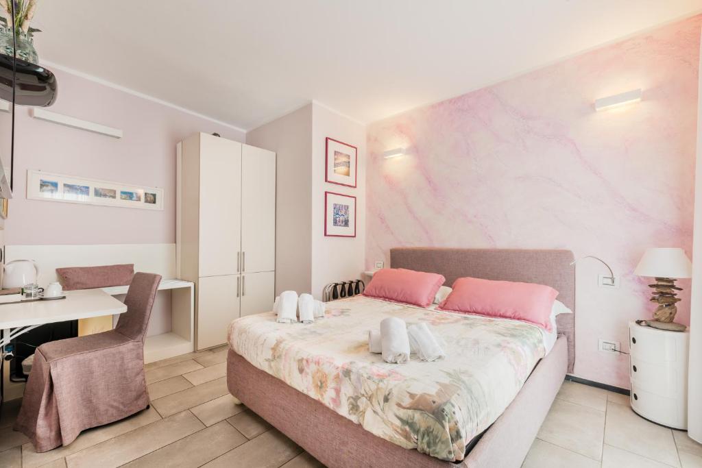 Postel nebo postele na pokoji v ubytování Casa Catò