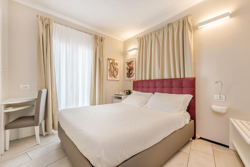 Postel nebo postele na pokoji v ubytování Casa Catò