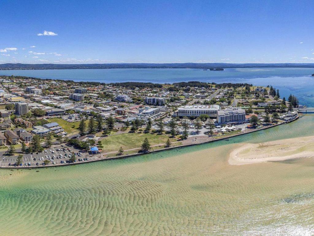 an aerial view of a resort on the beach at Sundowner Apartment 5 in The Entrance