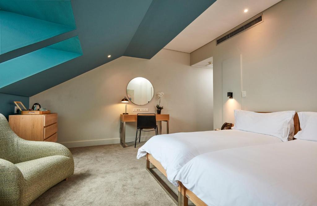 Cama ou camas em um quarto em Victoria & Alfred Hotel by NEWMARK