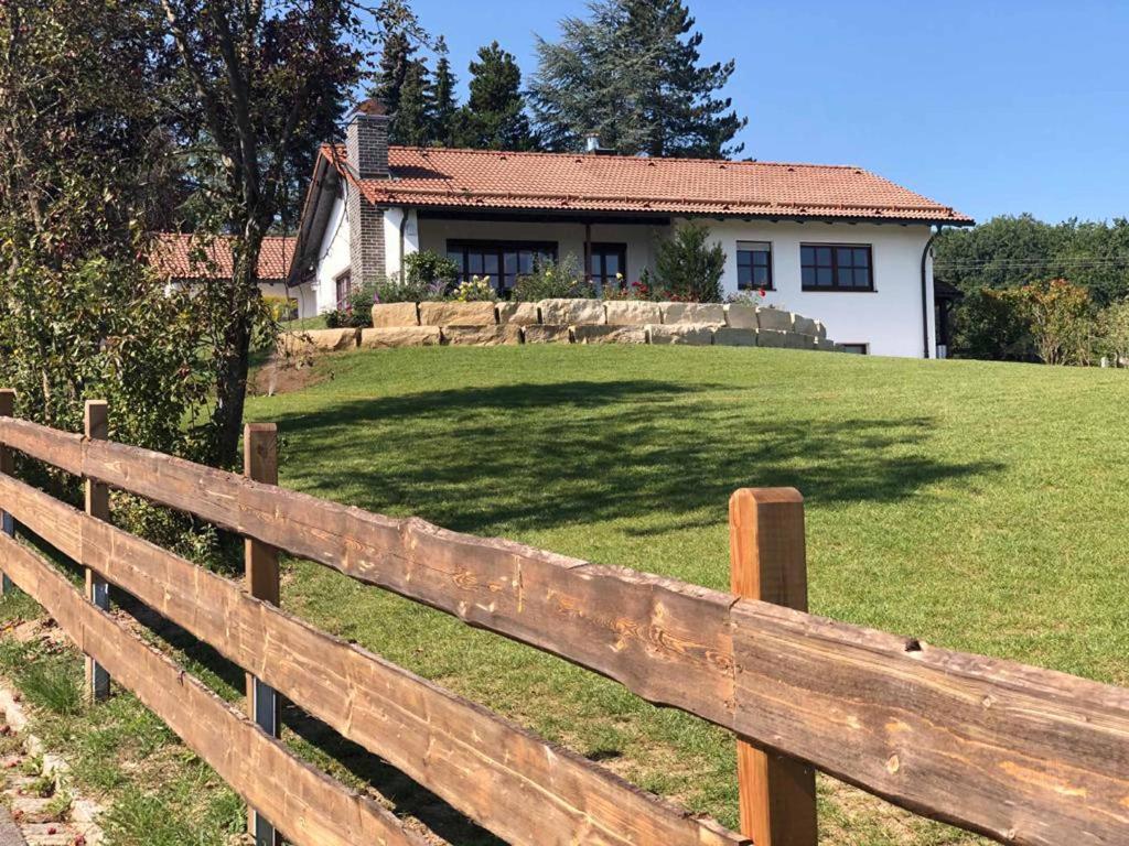 a wooden fence in front of a house at Landhaus Finest in Altdorf bei Nuernberg