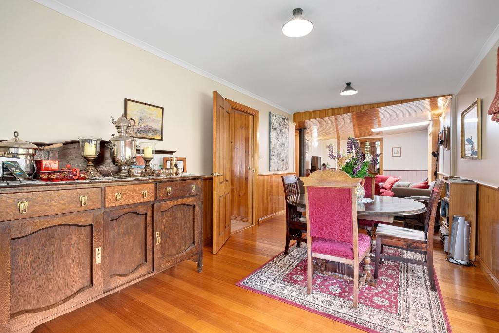 a kitchen with a table and a dining room at Hamlet Downs Country Accommodation in Fentonbury