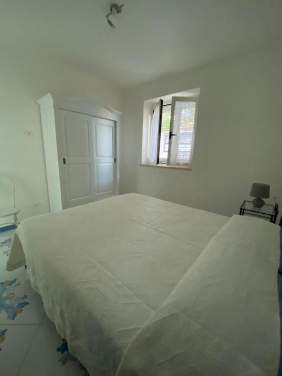 A bed or beds in a room at ''Dimora BellaVista'' - Marina di Camerota
